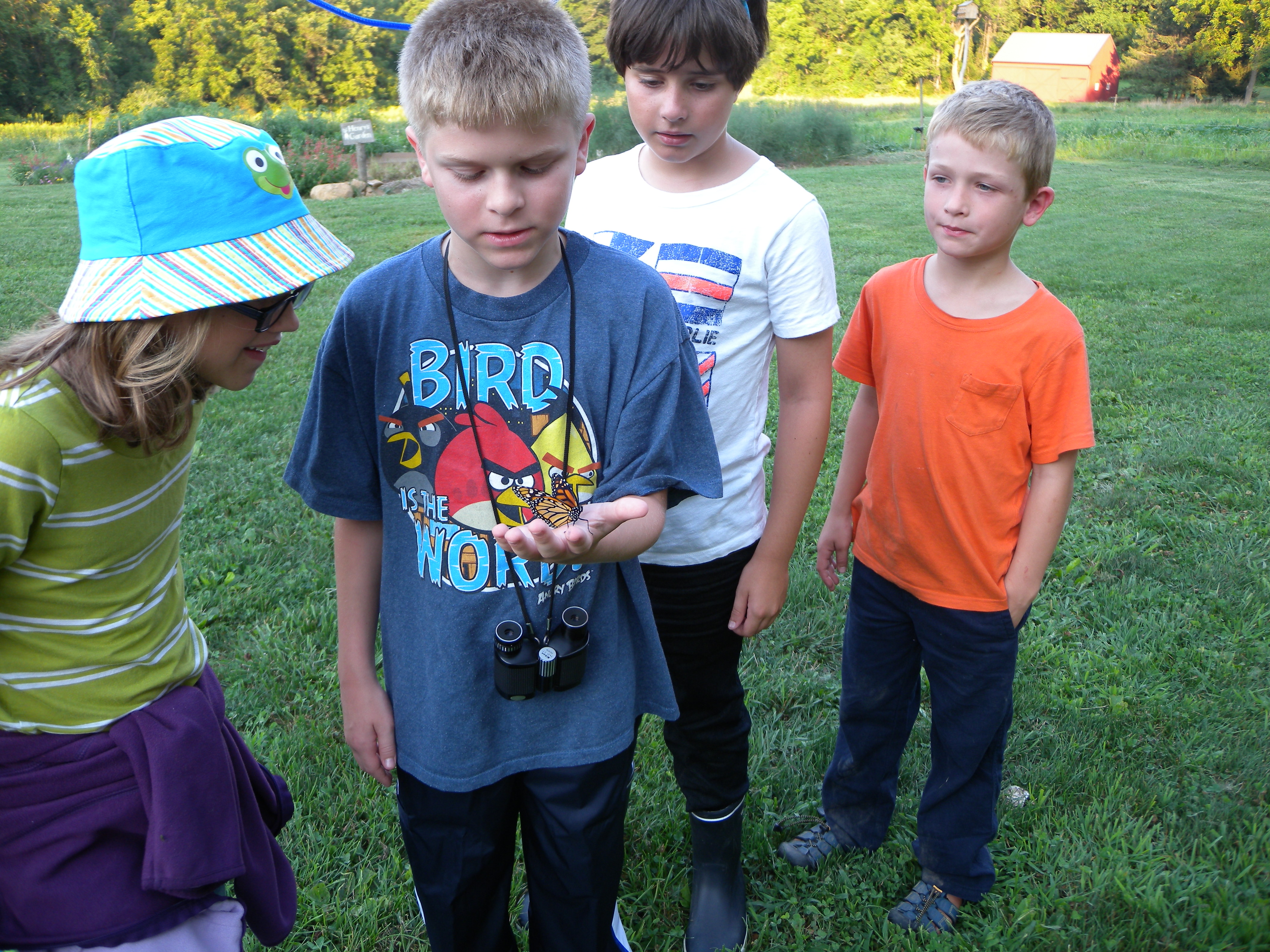 Young Birders releasing a Monarch Butterfly.  Photo by Blake Goll.